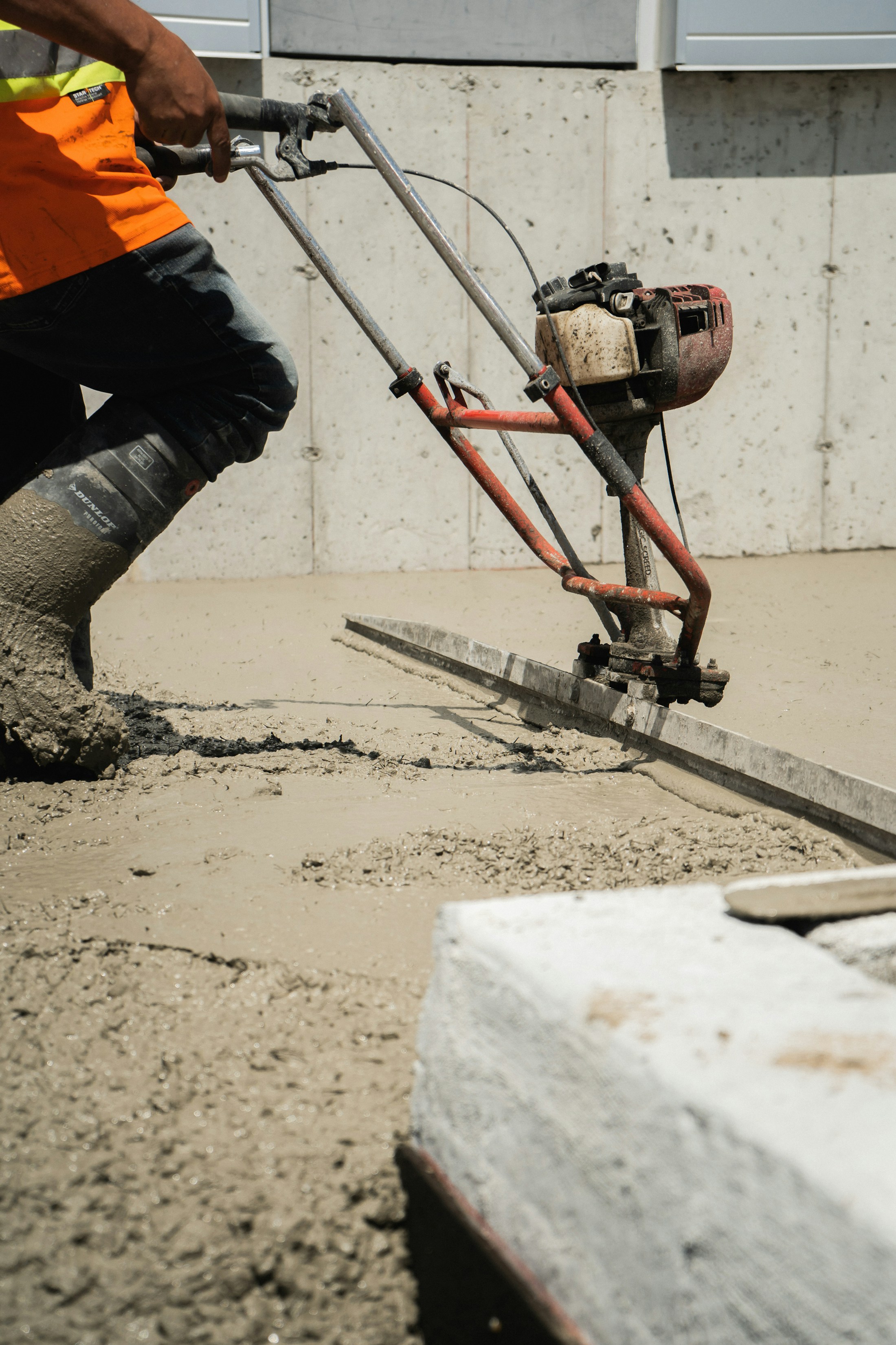 Concrete surface finishing on an active site